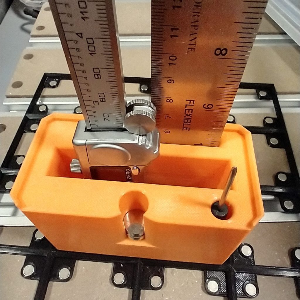 FreeGrid Caliper/ruler module. Base size 2 by 1 with openings for a steel ruler, digital calipers, a battery access screwdriver, and spare batteries.