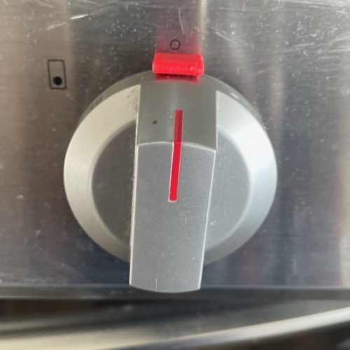 Safety knob lock in place on a stove.