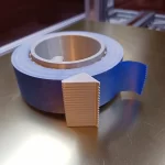 Tape dispenser with a reel of blue tape