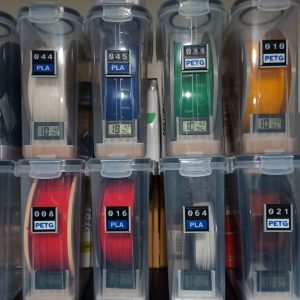 Eight storage boxes, each with a reel identifying tag attached.