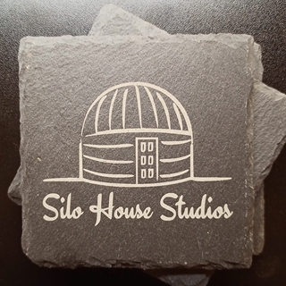 A slate tile with a laser-engraved logo for Silo House Studios