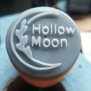 Mirror image of a potter's maker's mark that reads "Hollow Moon".